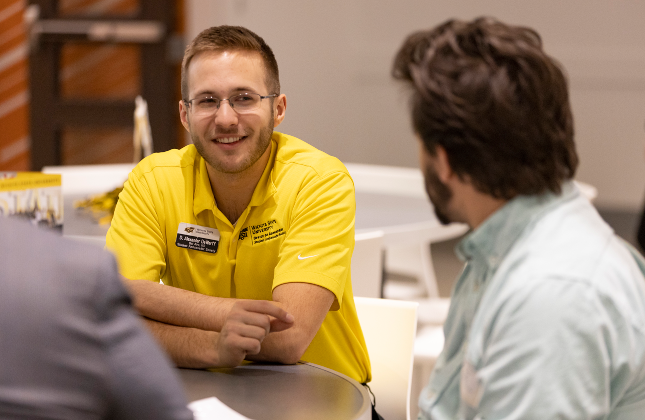 Student Ambassador smiles talking with a prospective student