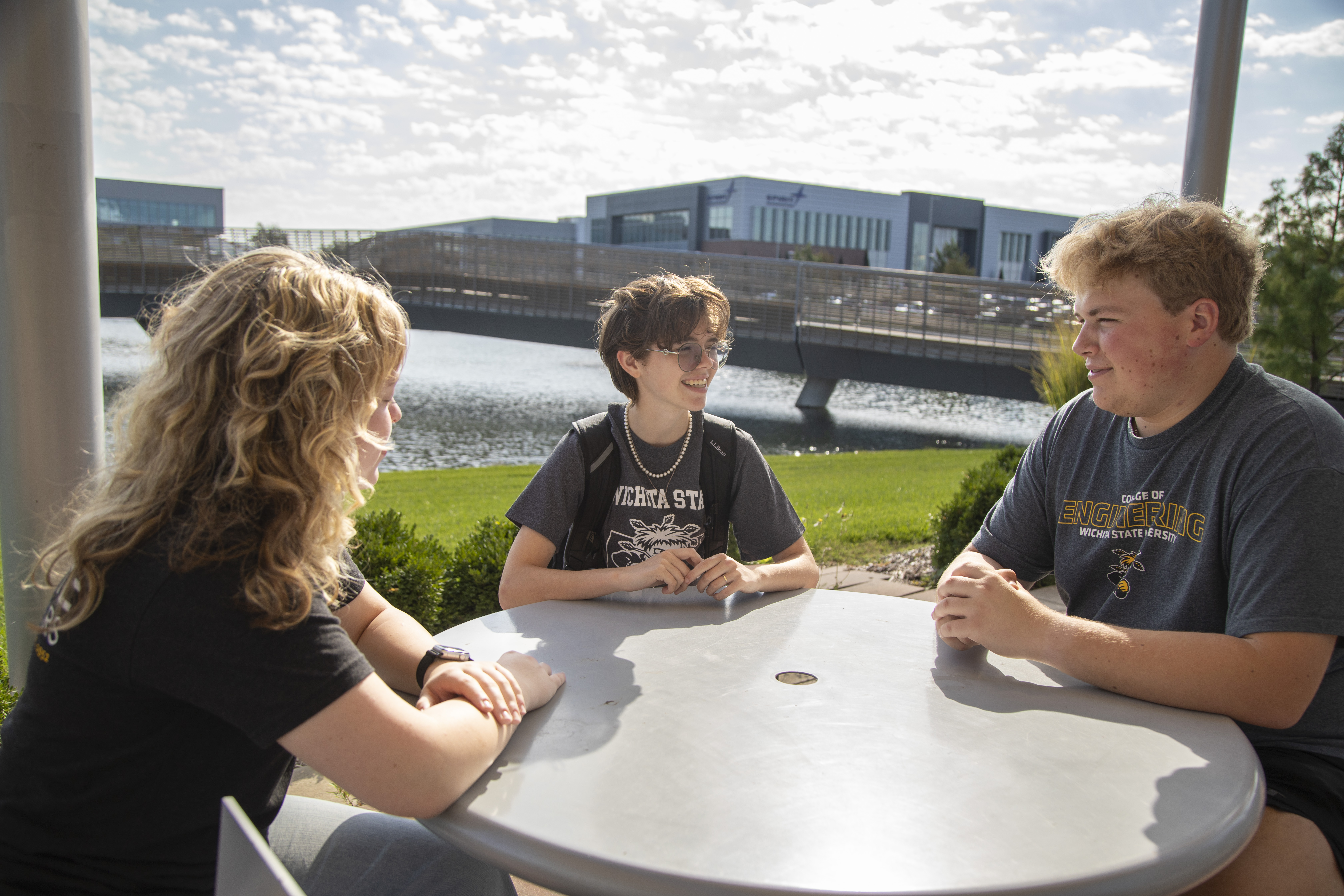 Students talking in front of the Promise Bridge