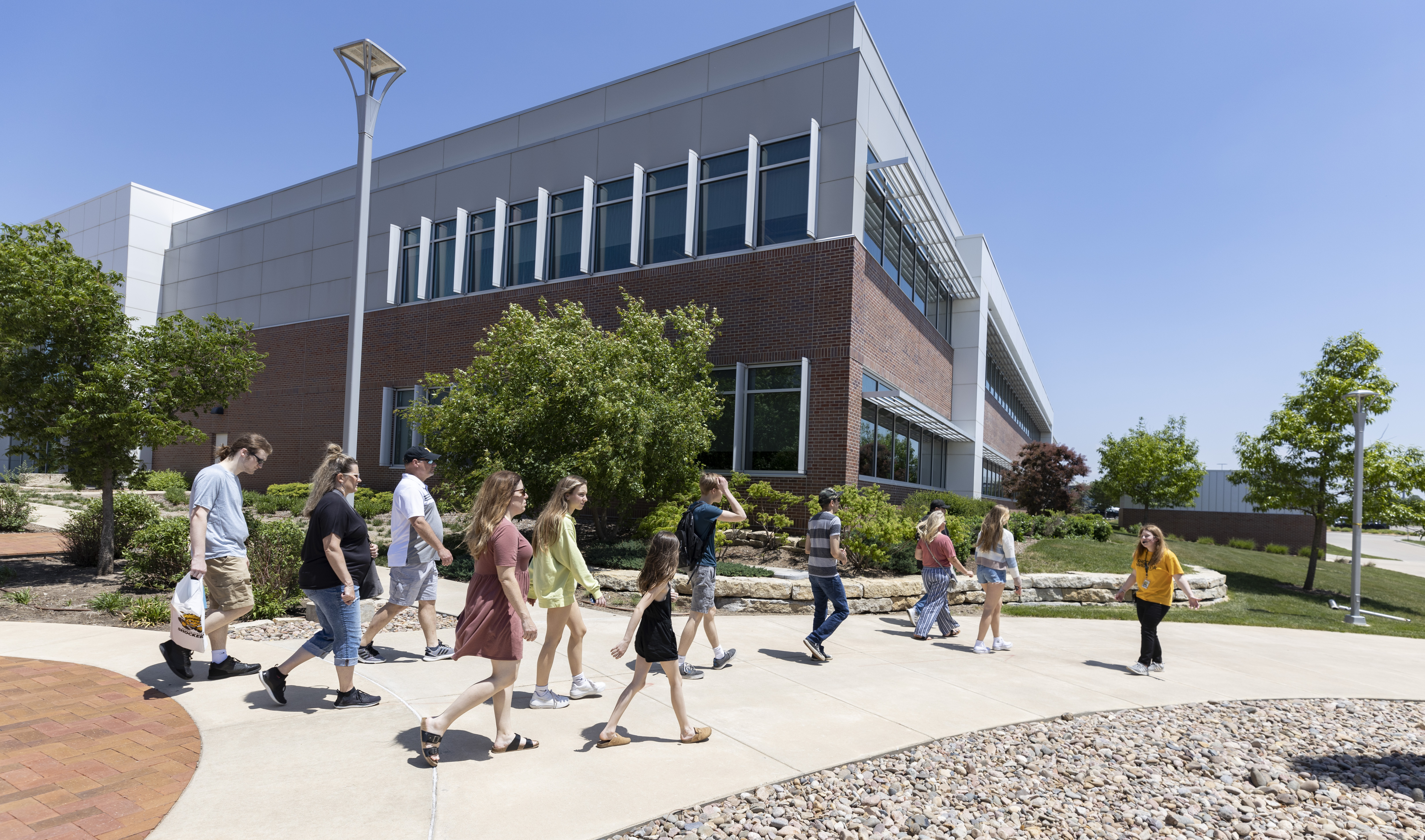 Tour group walking on campus