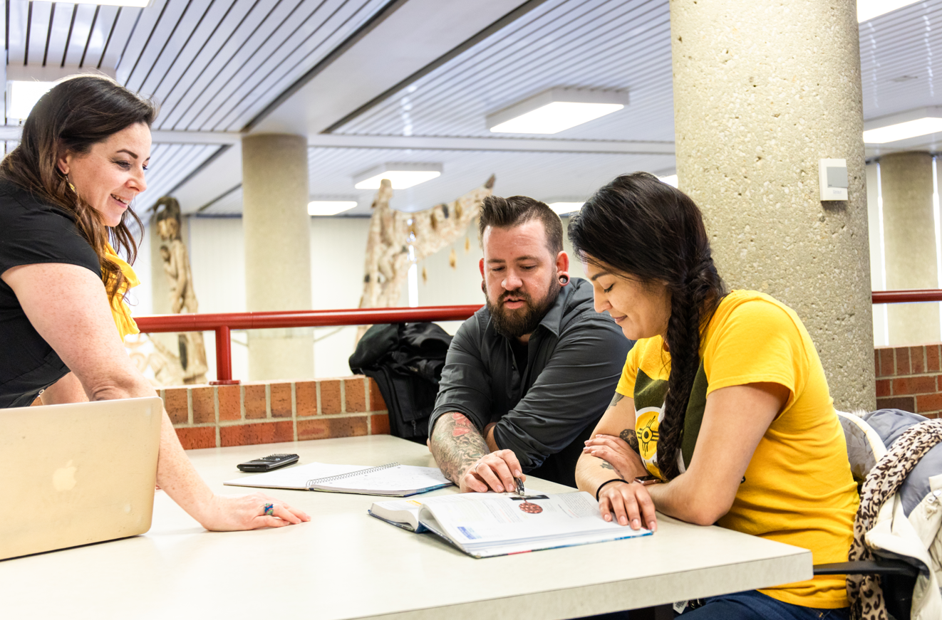 Adult students studying in the library
